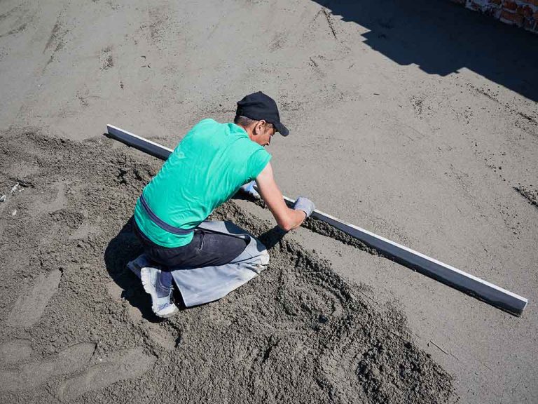 male-builder-screeding-floor-at-construction-site-2025-01-16-23-08-41-utc